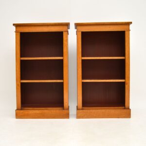 pair of antique birds eye maple open bookcases
